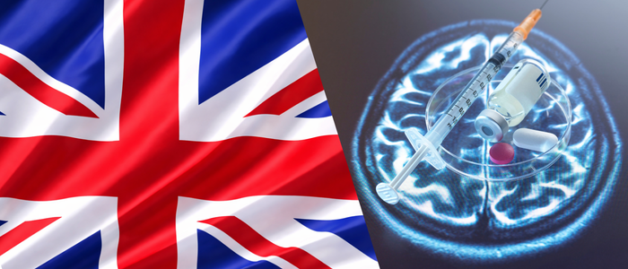UK flag beside a syringe, vaccine vial, and pills over a brain scan.