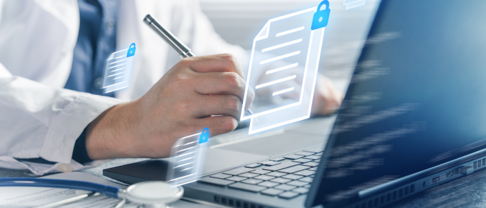 Clinician writes notes beside a laptop with floating secure medical document icons and padlock symbols.