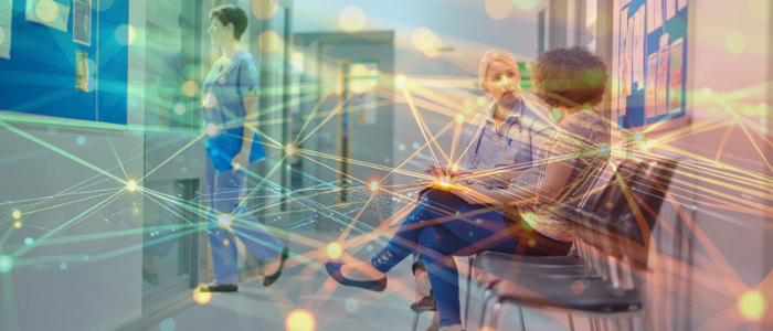 Healthcare professionals sit and talk in a hospital corridor, overlaid with glowing network lines and connected data nodes.