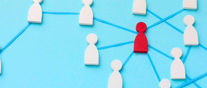 Red human figure connected by blue lines to surrounding white figures in a network on a light blue background, representing a rare disease patient and connection.