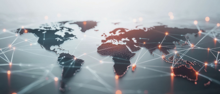 Digital world map shows glowing network connections across continents.