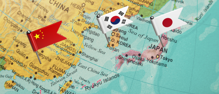 Map of East Asia with flags marking China, South Korea, and Japan.