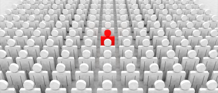 Red figure stands out among rows of grey figures.