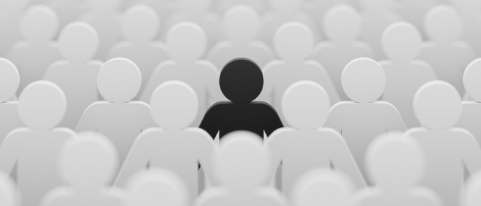 Single black human figure stands out among rows of white figures, illustrating an individual with a rare disease.
