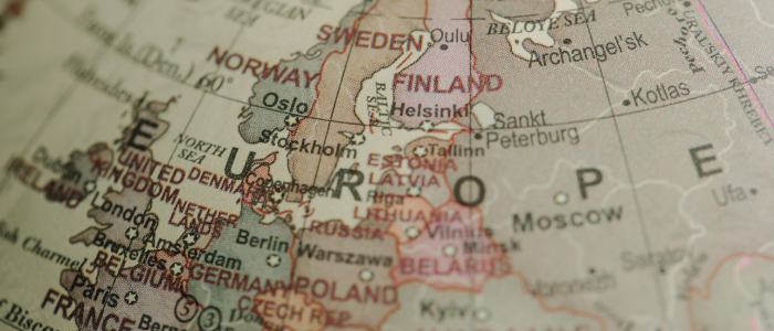 Close-up of a printed globe showing a detailed map of Europe, including country names and major cities.