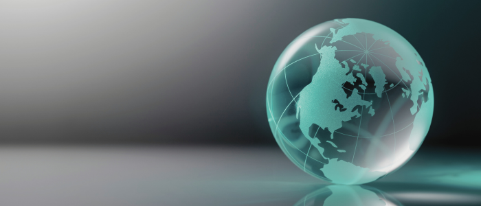 Blue and green glass globe against a black background, representing CMS’s finalized GLOBE model and changes to projected drug savings.