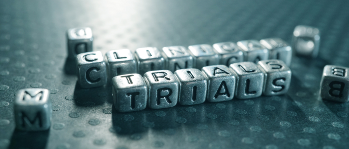 Metal letters spelling ‘clinical trials,’ representing efforts to modernize clinical research and accelerate evidence generation