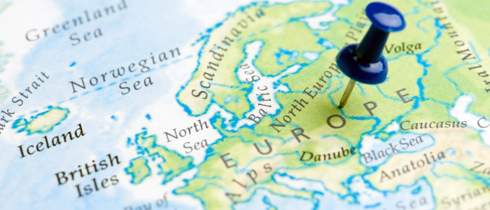 Map of Europe with a blue pushpin marking a location.