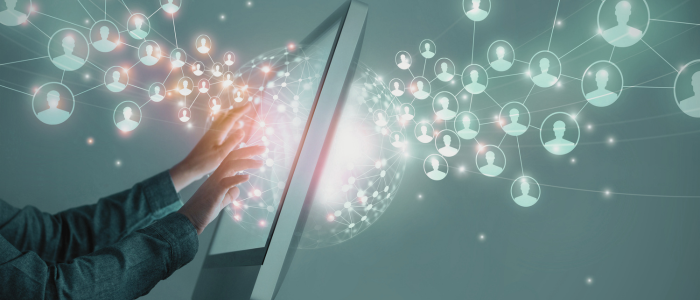 Hands interacting with a touchscreen as digital network icons represent real-world data exchange in healthcare