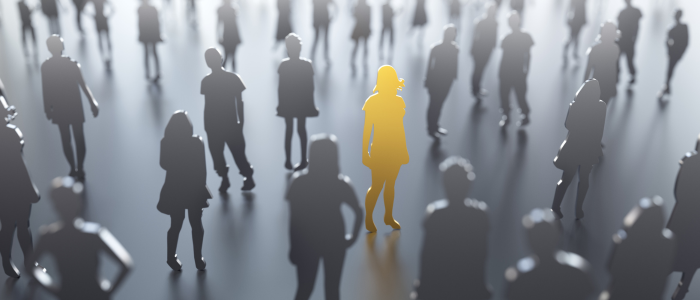 Crowd of grey silhouetted figures with one highlighted yellow figure standing out in the centre, representing a rare disease patient.