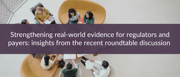 Overhead view of people sitting in a round seating area discussing documents, with text reading “Strengthening real-world evidence for regulators and payers: insights from the recent roundtable discussion.”