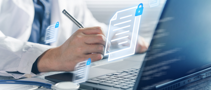 Clinician writes beside a laptop with floating secure medical record icons and padlock symbols representing protected health data.