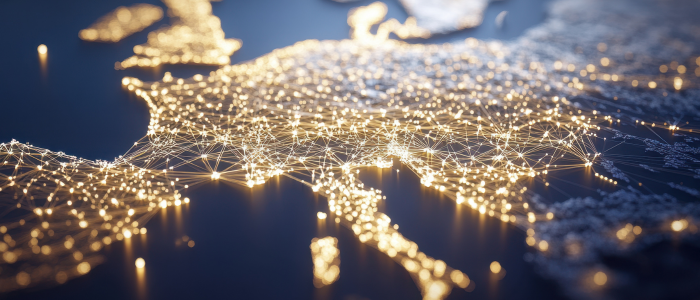 Illuminated map of Europe with glowing network connections across countries, shown against a dark blue background.