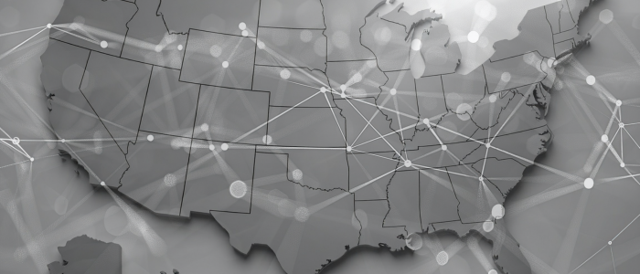 Grey map of the United States overlaid with connecting network lines and nodes, symbolising real-world data links across states.